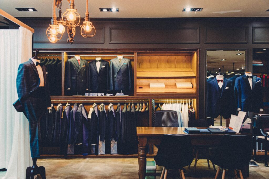 Black suit jacket on brown wooden chair