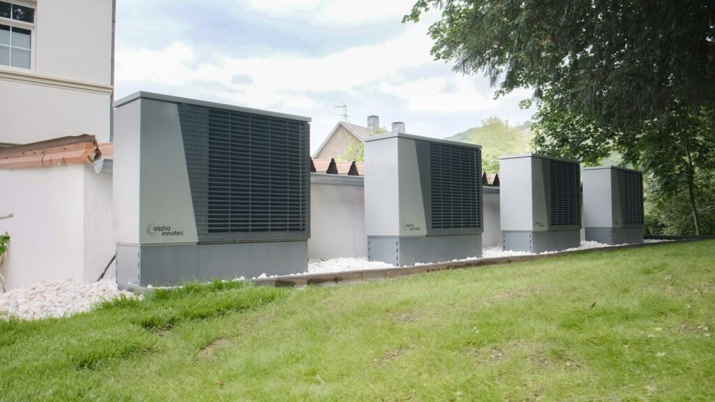 Large industrial air conditioning units lined up outside building