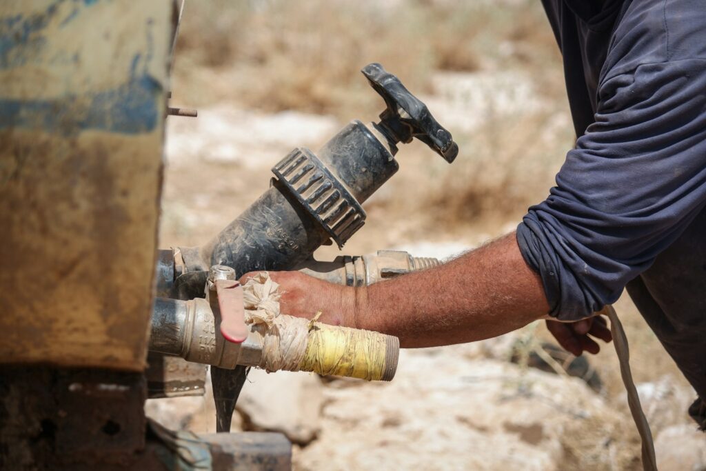 A person holding a pipe