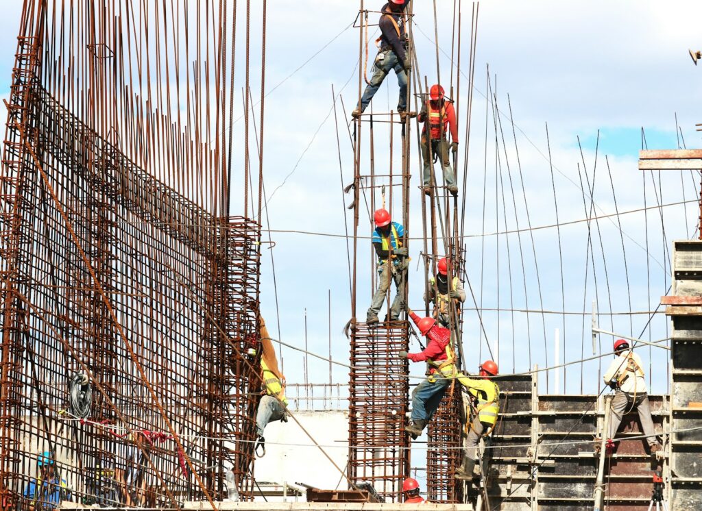 People working on building during daytime