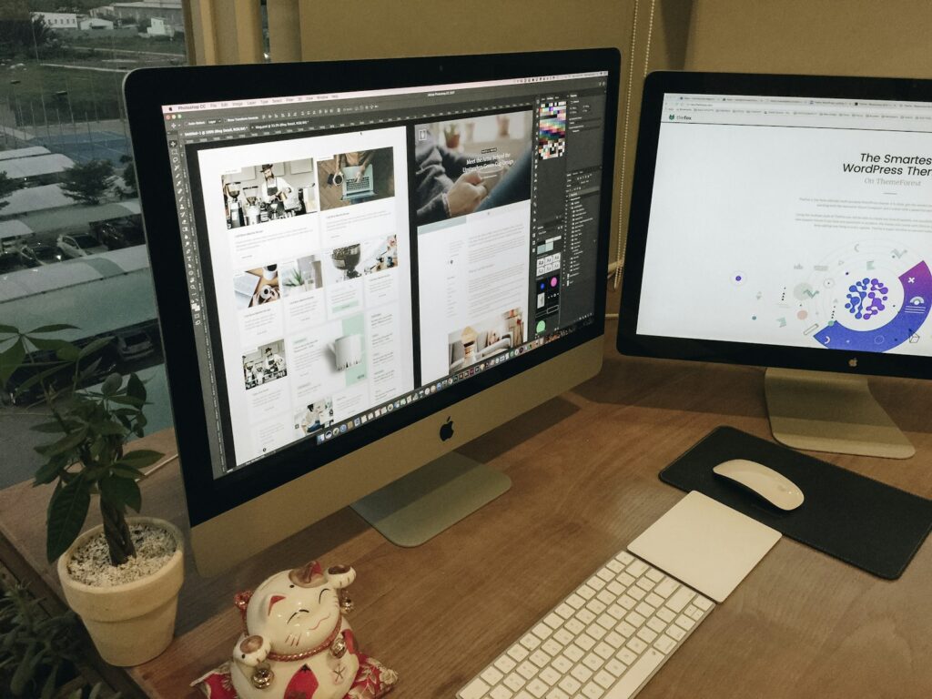 A desk with two computer monitors and a keyboard